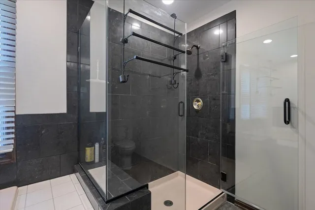 a bathroom with a shower and a sink