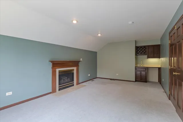 a room with a sink and cabinets
