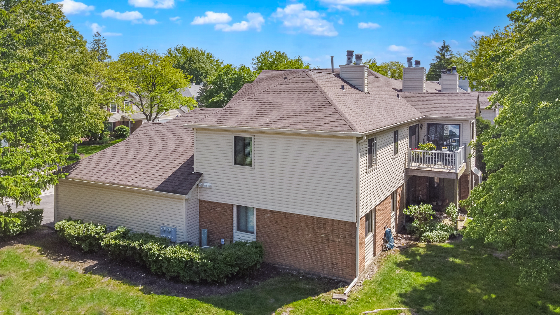 -n120 Windermere Road, Unit 2008 Winfield, IL 60190 - Photo 22 of 23 a aerial view of a house with a yard and potted plants