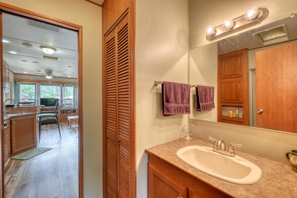 568 Parks Road Hiawassee, GA 30546 - Photo 22 of 38 a bathroom with a sink and a mirror
