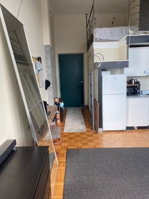 61 Brookline Avenue, Unit 419 Boston, MA 02215 - Photo 2 of 9 a view of a living room washer and dryer