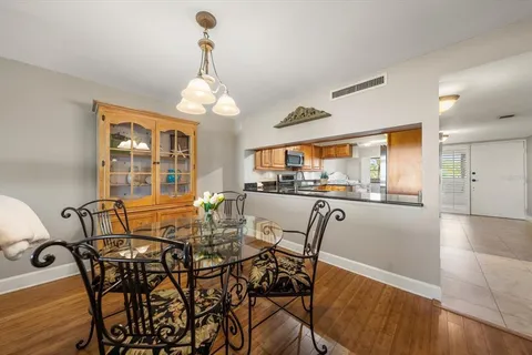 a view of a dining room with furniture window and outside view