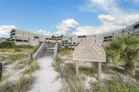 a view of a swimming pool with a balcony