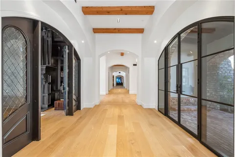 a view of a hallway view with staircase