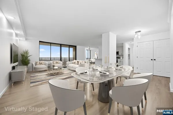 a view of a dining room with furniture and window