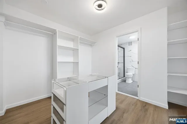 a utility room with cabinets washer and dryer