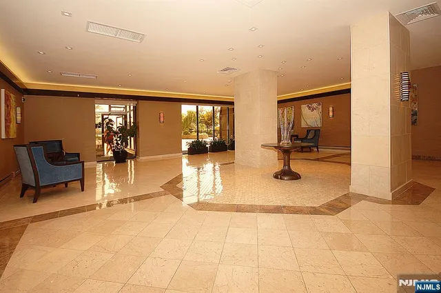 a view of a lobby with furniture and floor to ceiling window