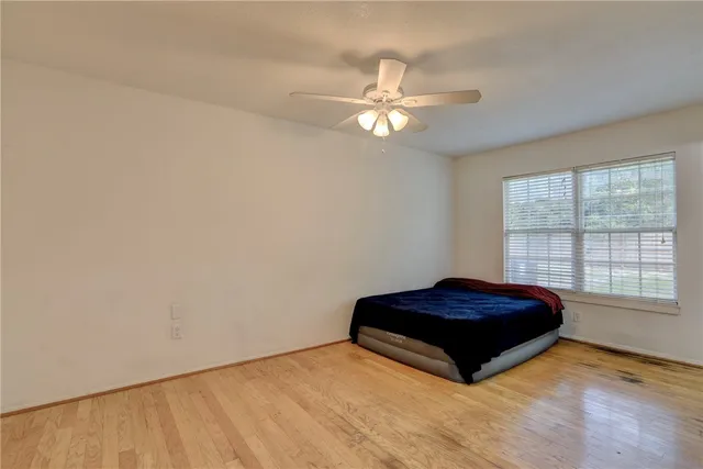 a room with a bed and a window