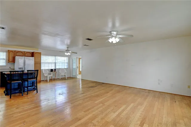 a view of a livingroom with furniture nad wooden floor