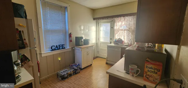 a view of workspace with wooden floor windows