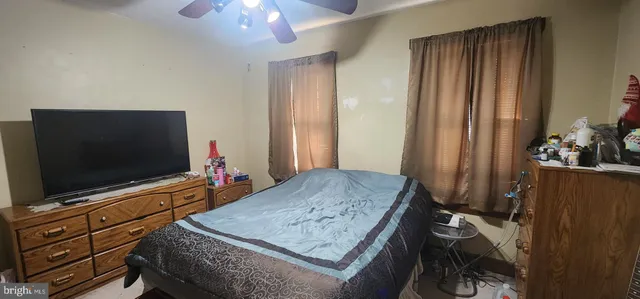 a living room with furniture and flat screen tv