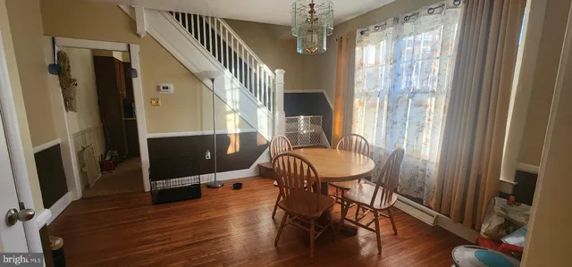 a view of a room with furniture window and wooden floor