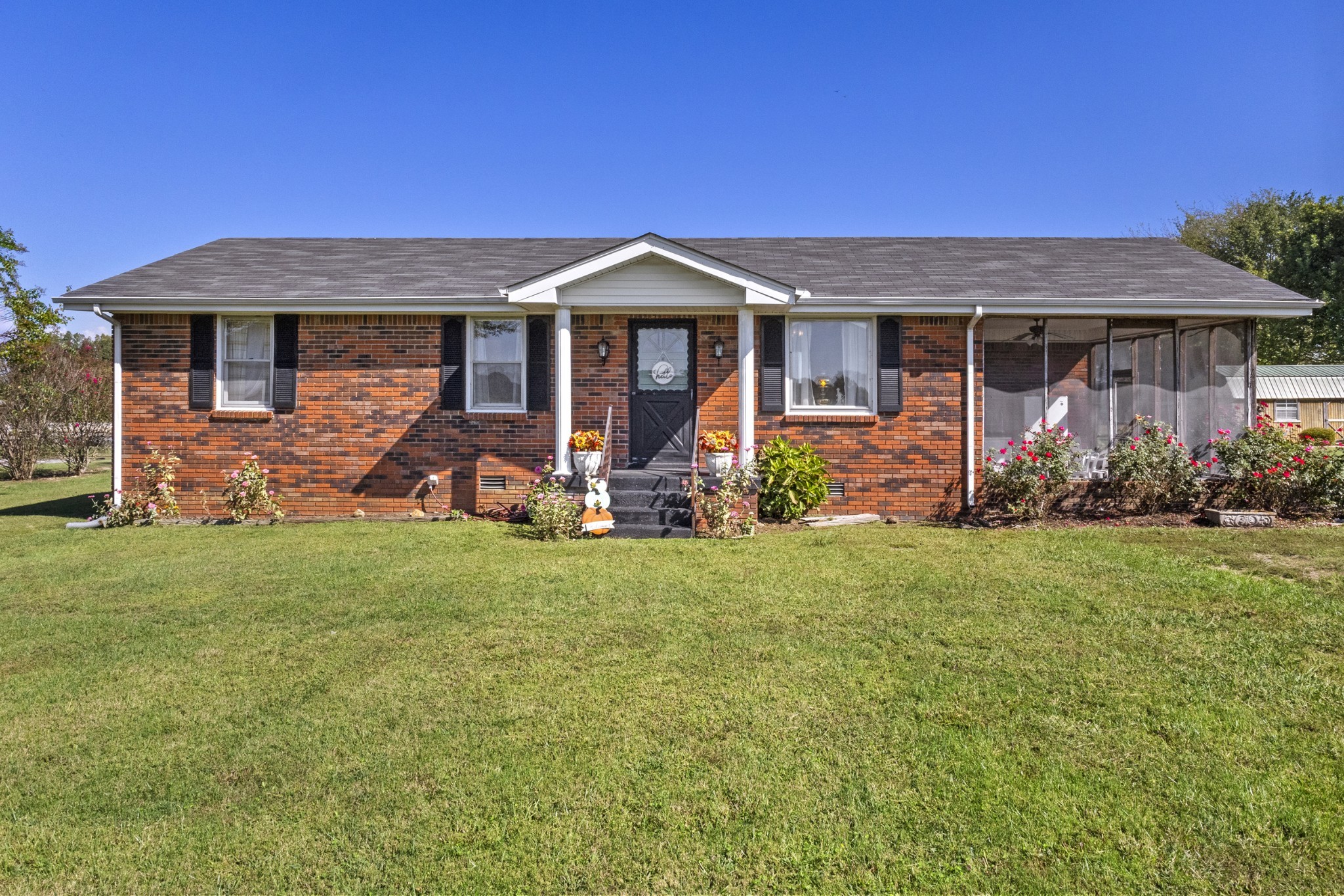 2487 Highway 52 West Portland, TN 37148 - Photo 1 of 49 a front view of a house with garden