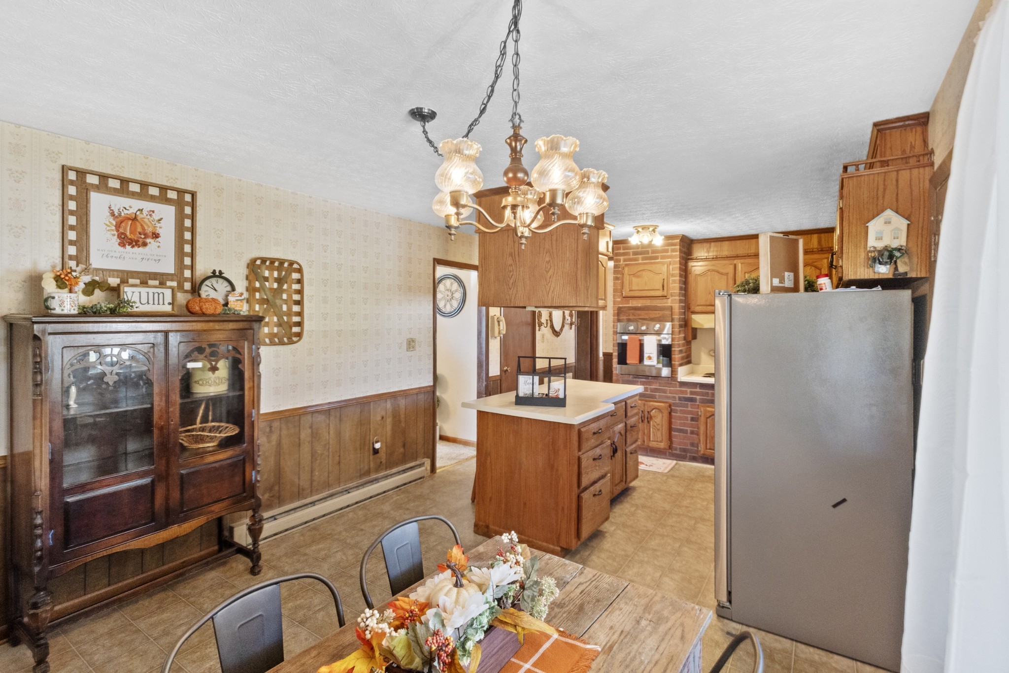 2487 Highway 52 West Portland, TN 37148 - Photo 9 of 49 a living room with furniture and a chandelier