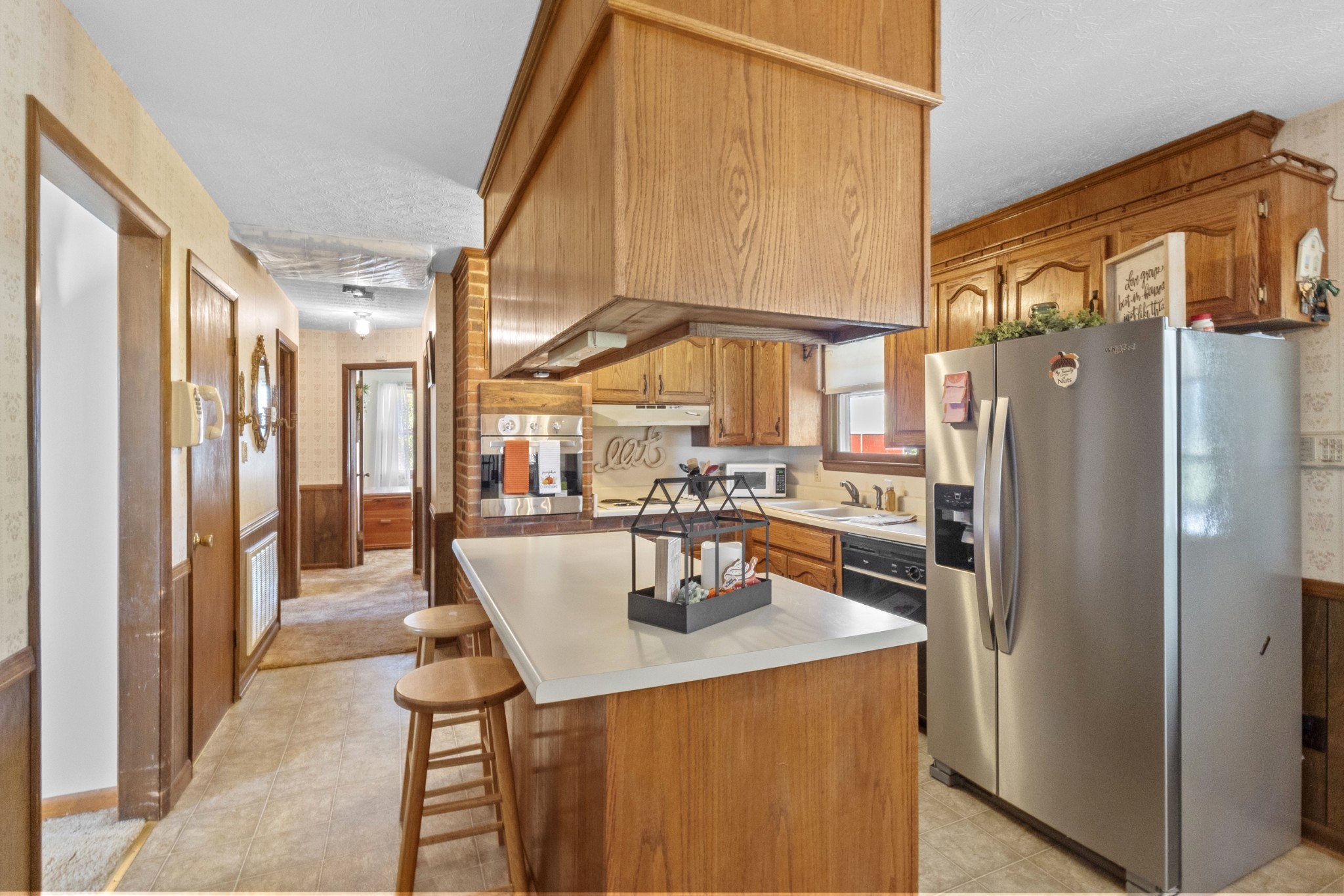 2487 Highway 52 West Portland, TN 37148 - Photo 10 of 49 a kitchen with stainless steel appliances granite countertop a refrigerator a oven and white cabinets