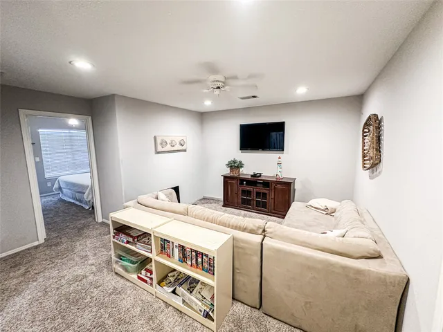 a room with furniture and a flat screen tv