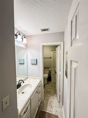 a spacious bathroom with a bathtub and a sink