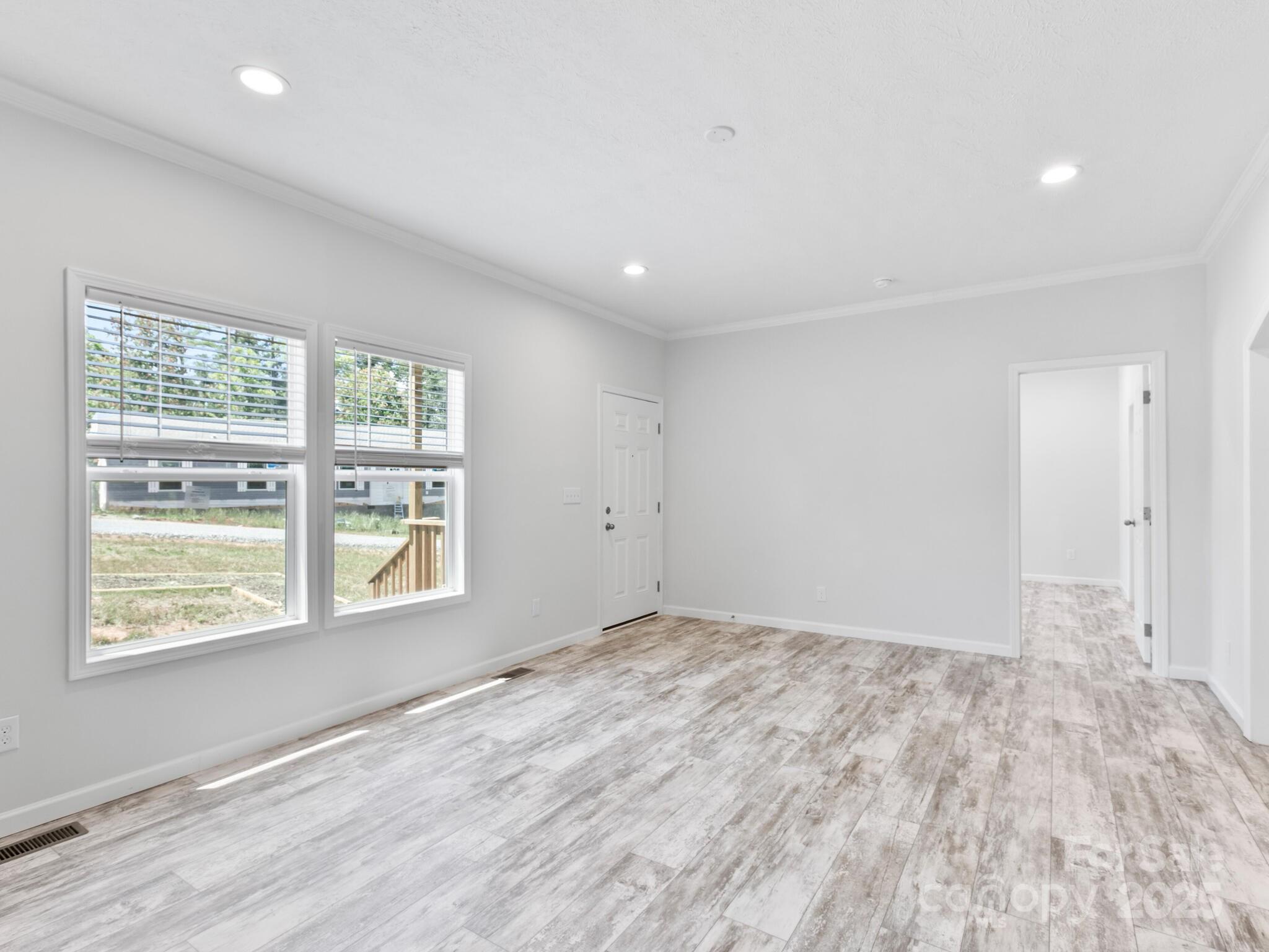 208 Walnut Br Road Weaverville, NC 28787 - Photo 3 of 20 a view of an empty room with a window