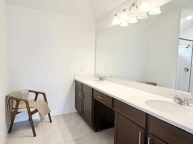 a bathroom with a glass shower door