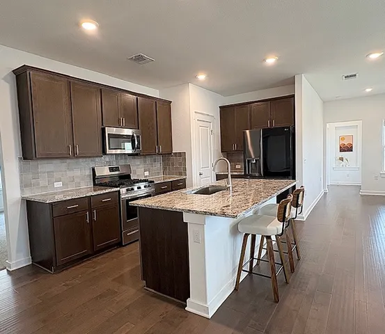 a bathroom with a sink vanity and a mirror
