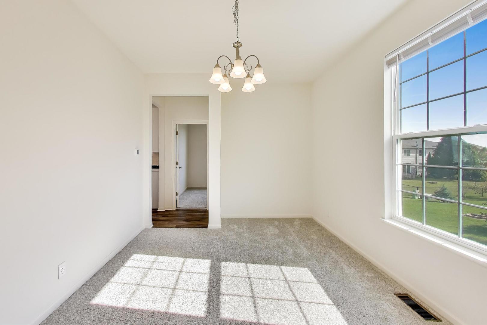 2058 Ingemunson Lane Yorkville, IL 60560 - Photo 12 of 55 a view of an empty room with a window