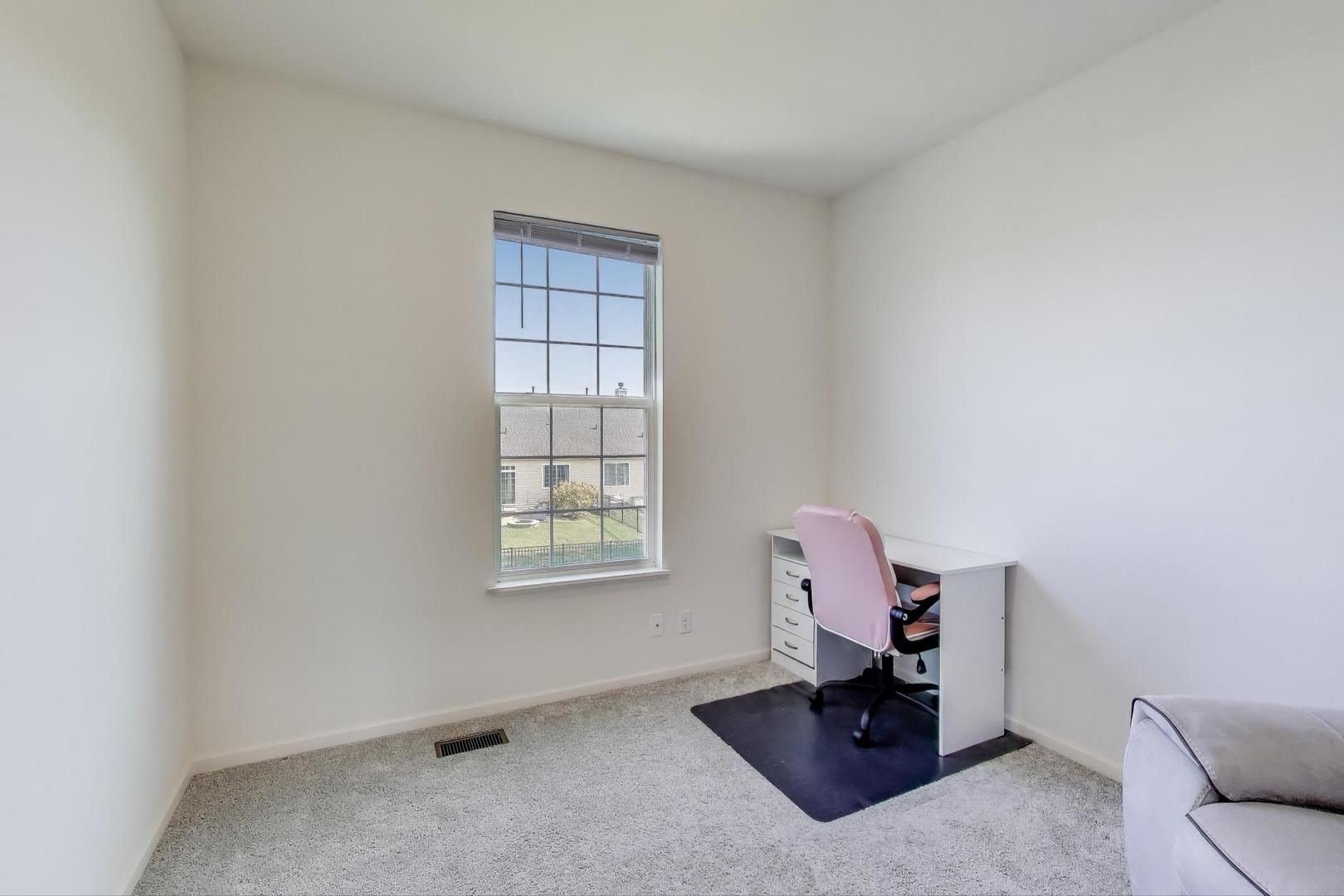 2058 Ingemunson Lane Yorkville, IL 60560 - Photo 13 of 55 a living room with furniture and a window