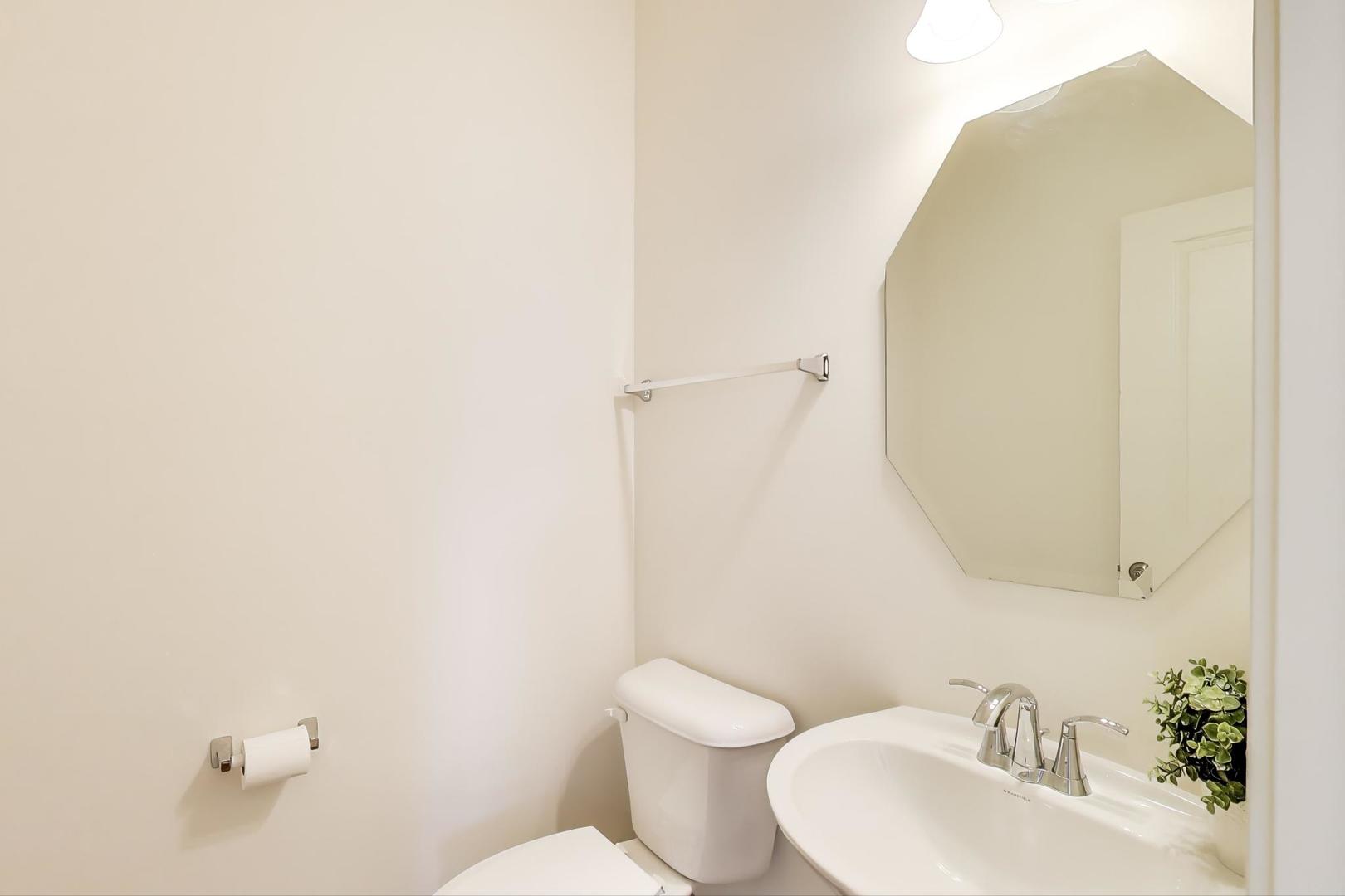 2058 Ingemunson Lane Yorkville, IL 60560 - Photo 15 of 55 a bathroom with a sink and mirror with toilet