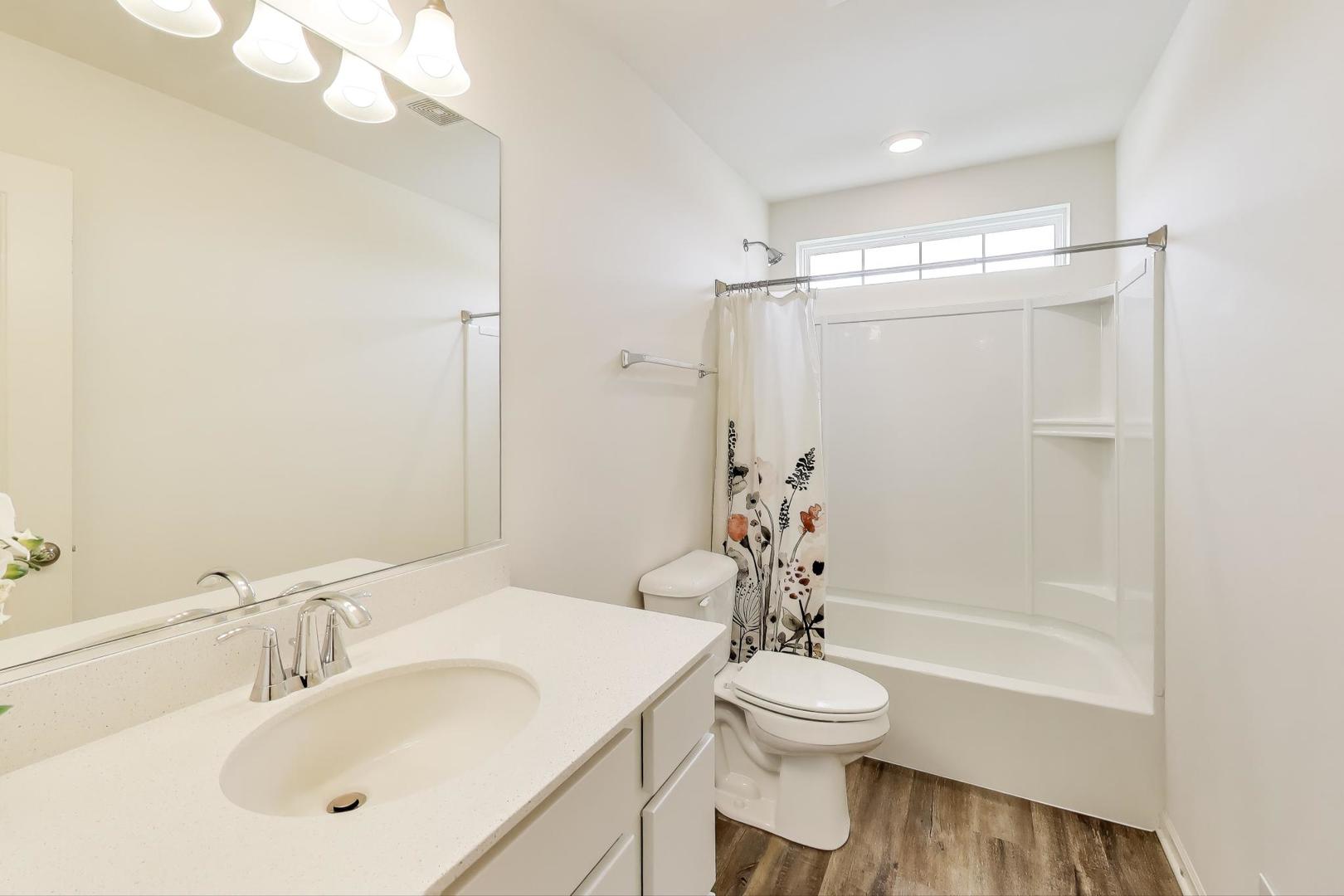 2058 Ingemunson Lane Yorkville, IL 60560 - Photo 25 of 55 a bathroom with a sink toilet and shower