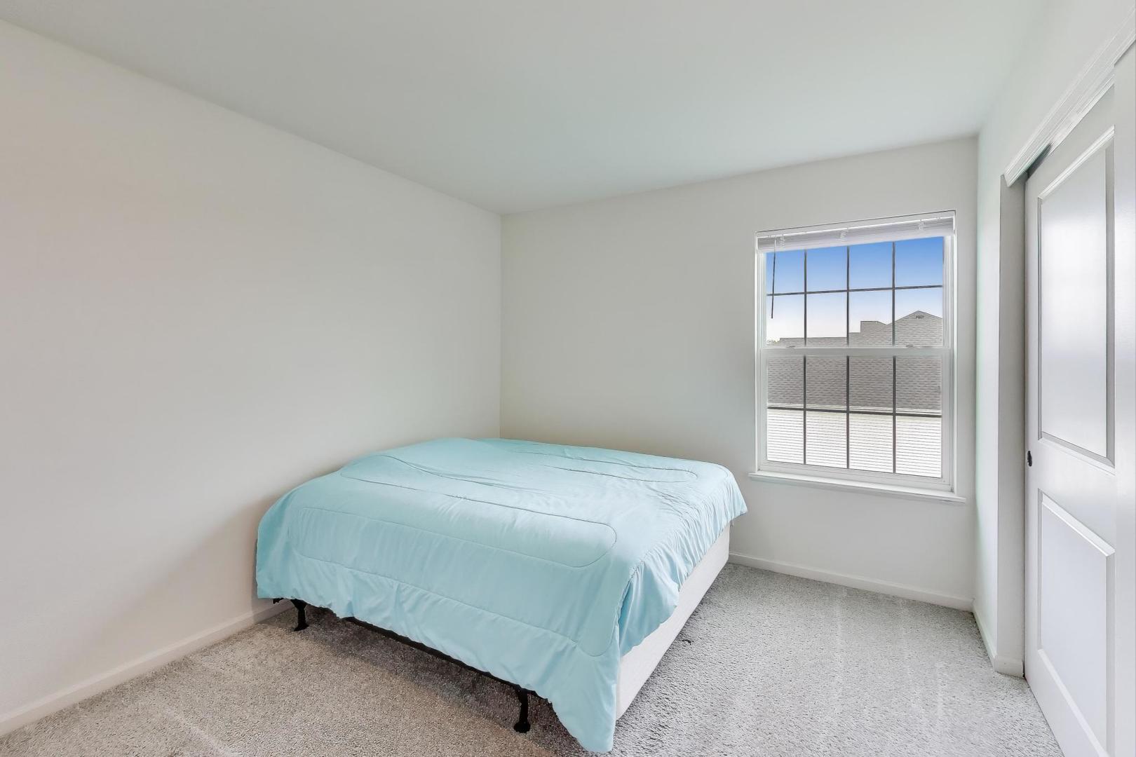 2058 Ingemunson Lane Yorkville, IL 60560 - Photo 27 of 55 a bedroom with a bed and window