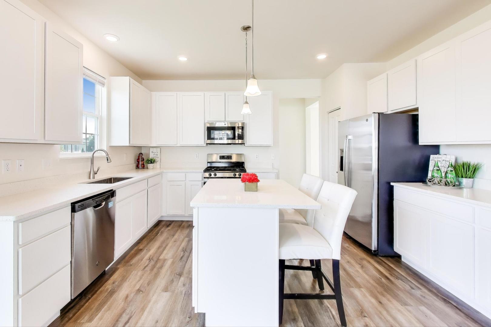 2058 Ingemunson Lane Yorkville, IL 60560 - Photo 3 of 55 a kitchen with white cabinets and white appliances