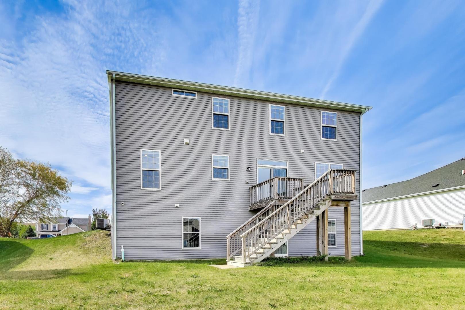 2058 Ingemunson Lane Yorkville, IL 60560 - Photo 36 of 55 a view of a house with a yard