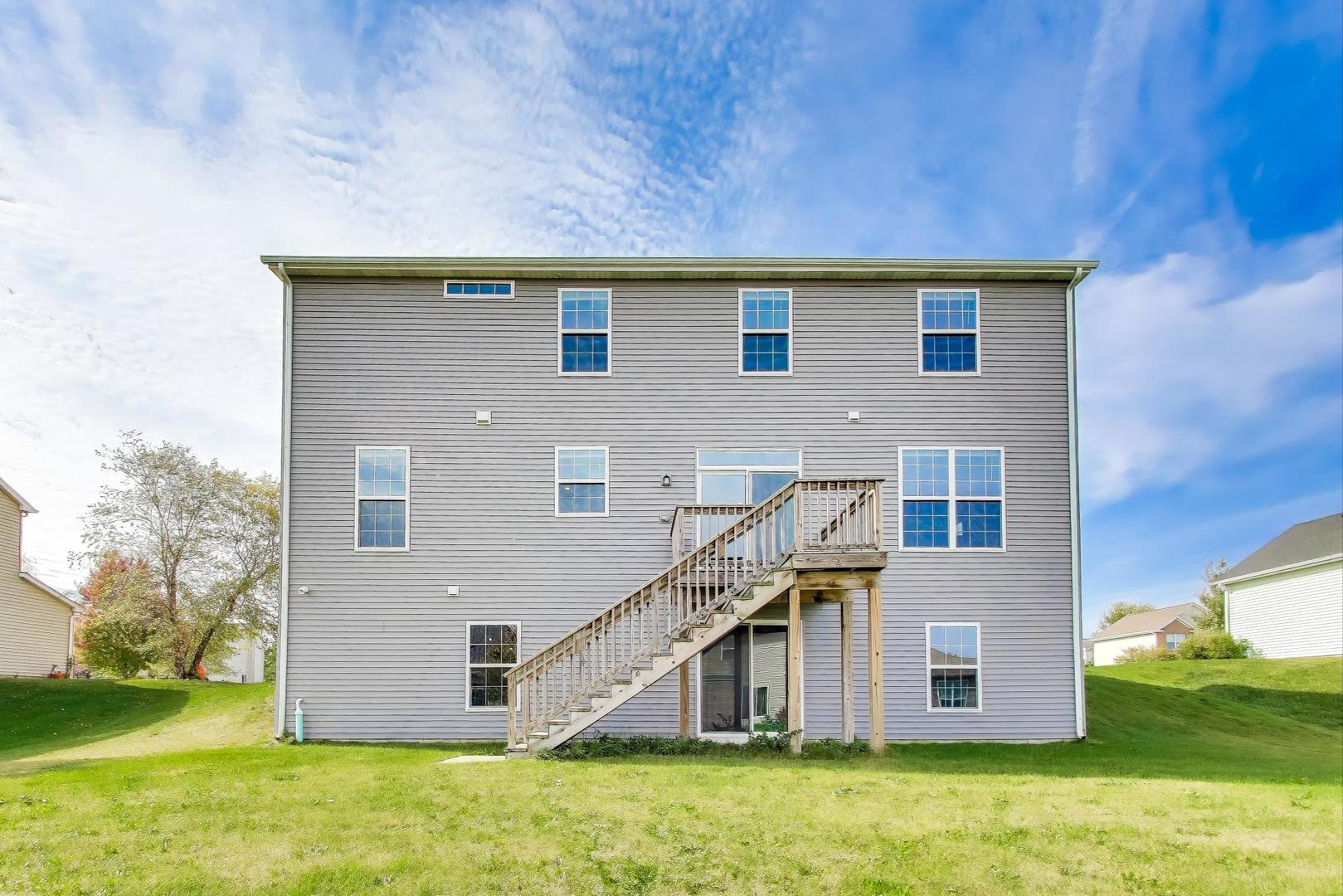 2058 Ingemunson Lane Yorkville, IL 60560 - Photo 37 of 55 a backyard of a house with a yard and garage