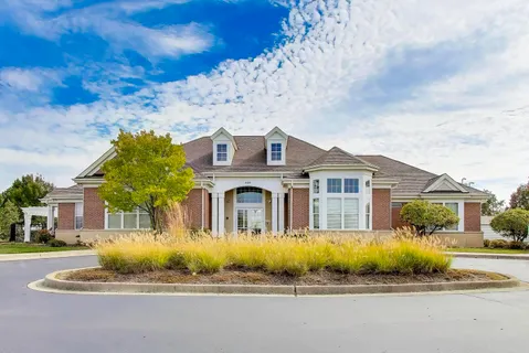 a view of house with yard