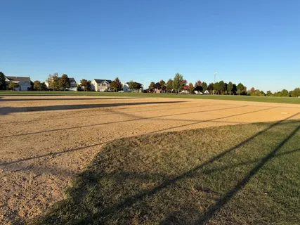 a picture of a bench in a white wall