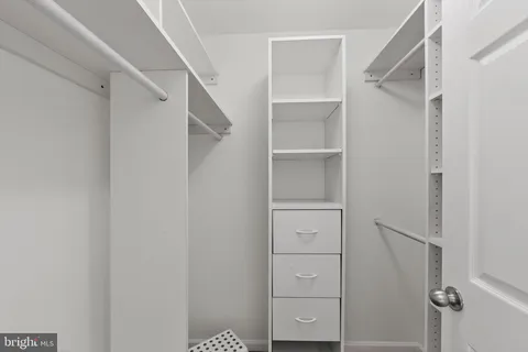 a bathroom with a shower sink and mirror