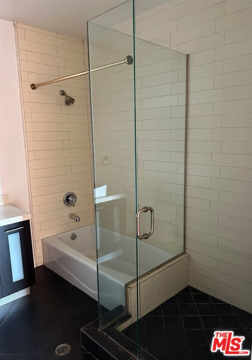 652 Mateo Street, Unit 303 Los Angeles, CA 90021 - Photo 8 of 12 a bathroom with a shower and a sink
