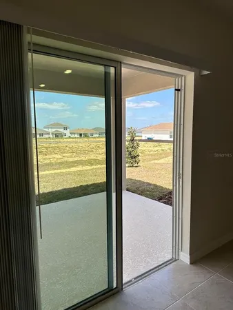 a view of an empty room with closet