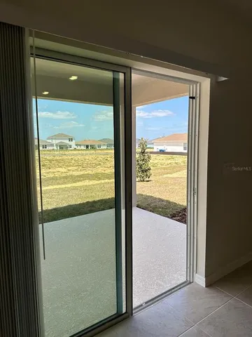 a view of an empty room with closet