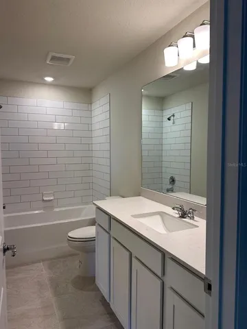 an empty room with a empty space and a window