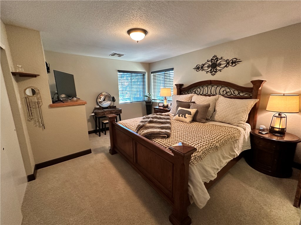 6615 Flag Mine Road Kingman, AZ 86401 - Photo 22 of 72 a bed room with a bed furniture and a window