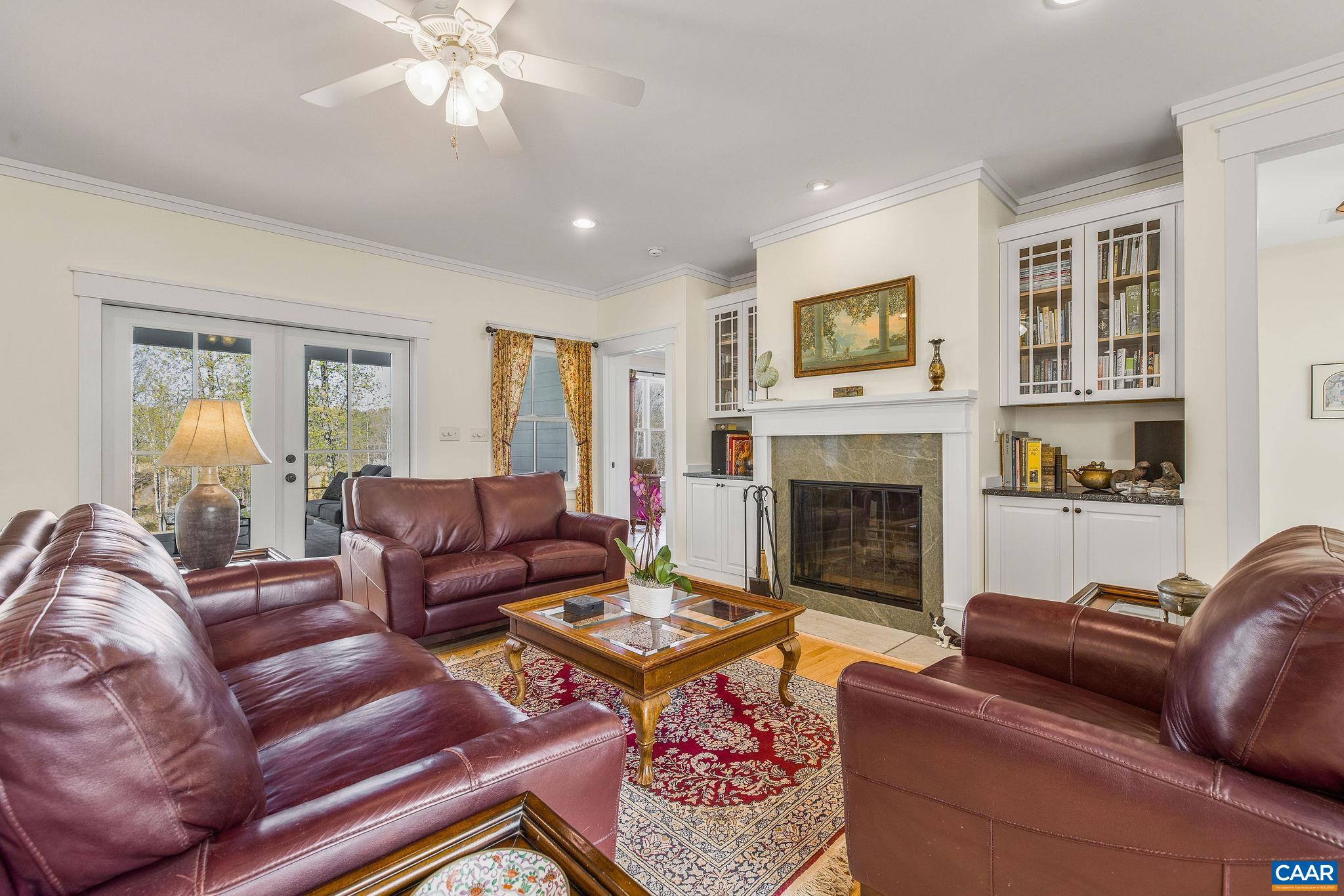4764 Advance Mills Road Earlysville, VA 22936 - Photo 44 of 72 a living room with furniture and a fireplace