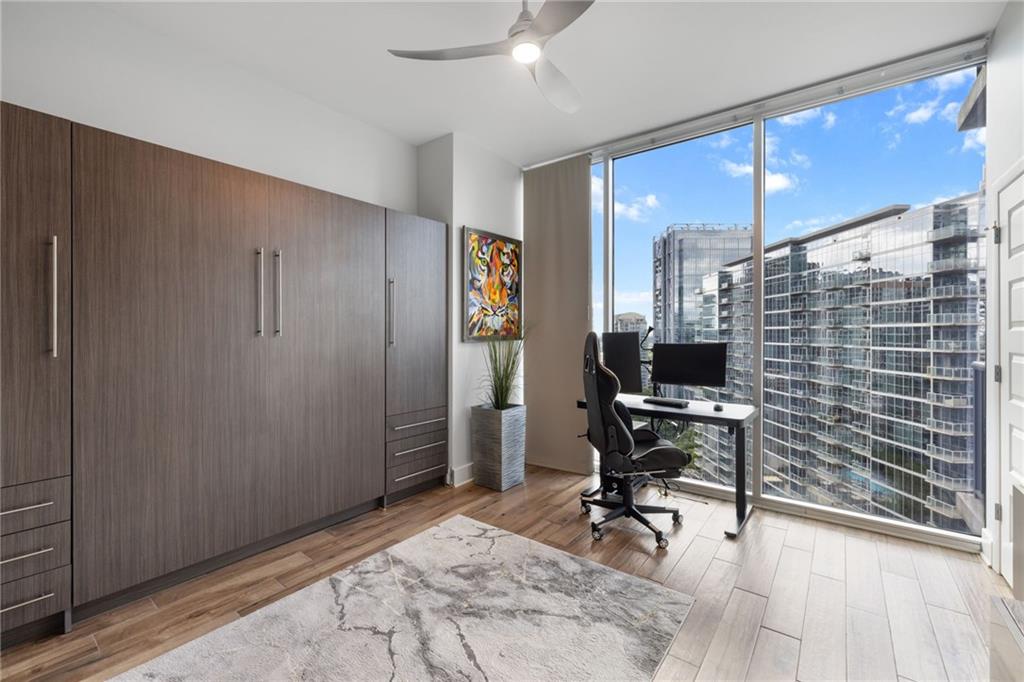 1080 Peachtree Street Northeast, Unit 1812 Atlanta, GA 30309 - Photo 6 of 13 a view of a workspace with furniture and a window