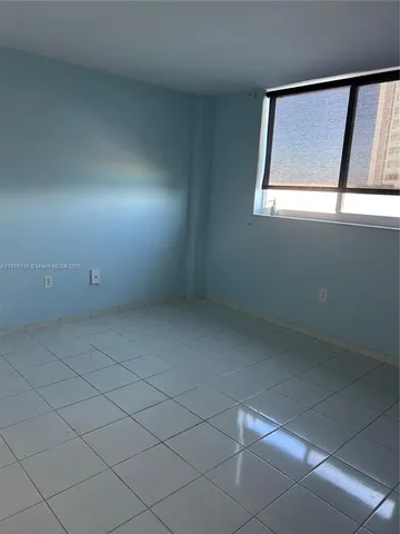 a view of empty room with windows