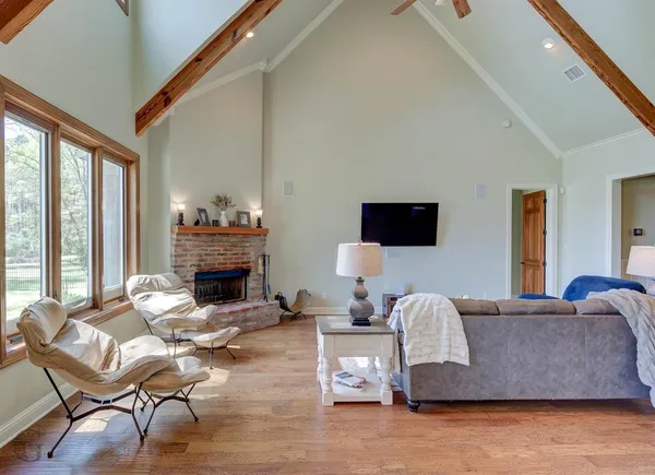 a living room with furniture and a fireplace