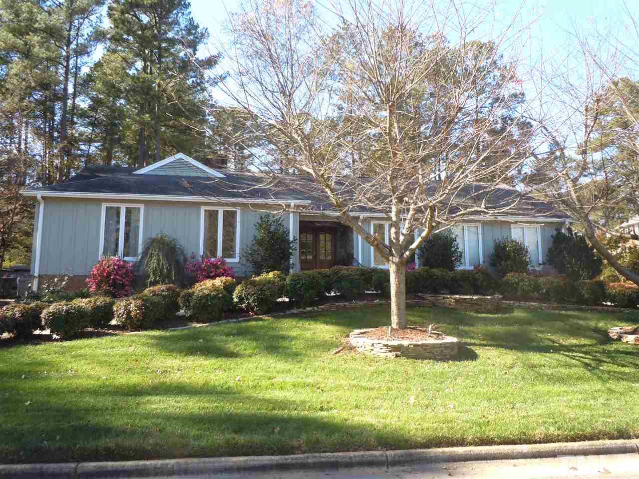 6909 Valley Ridge Court Raleigh, NC 27615 - Photo 1 of 25 a house that has a tree in front of the house
