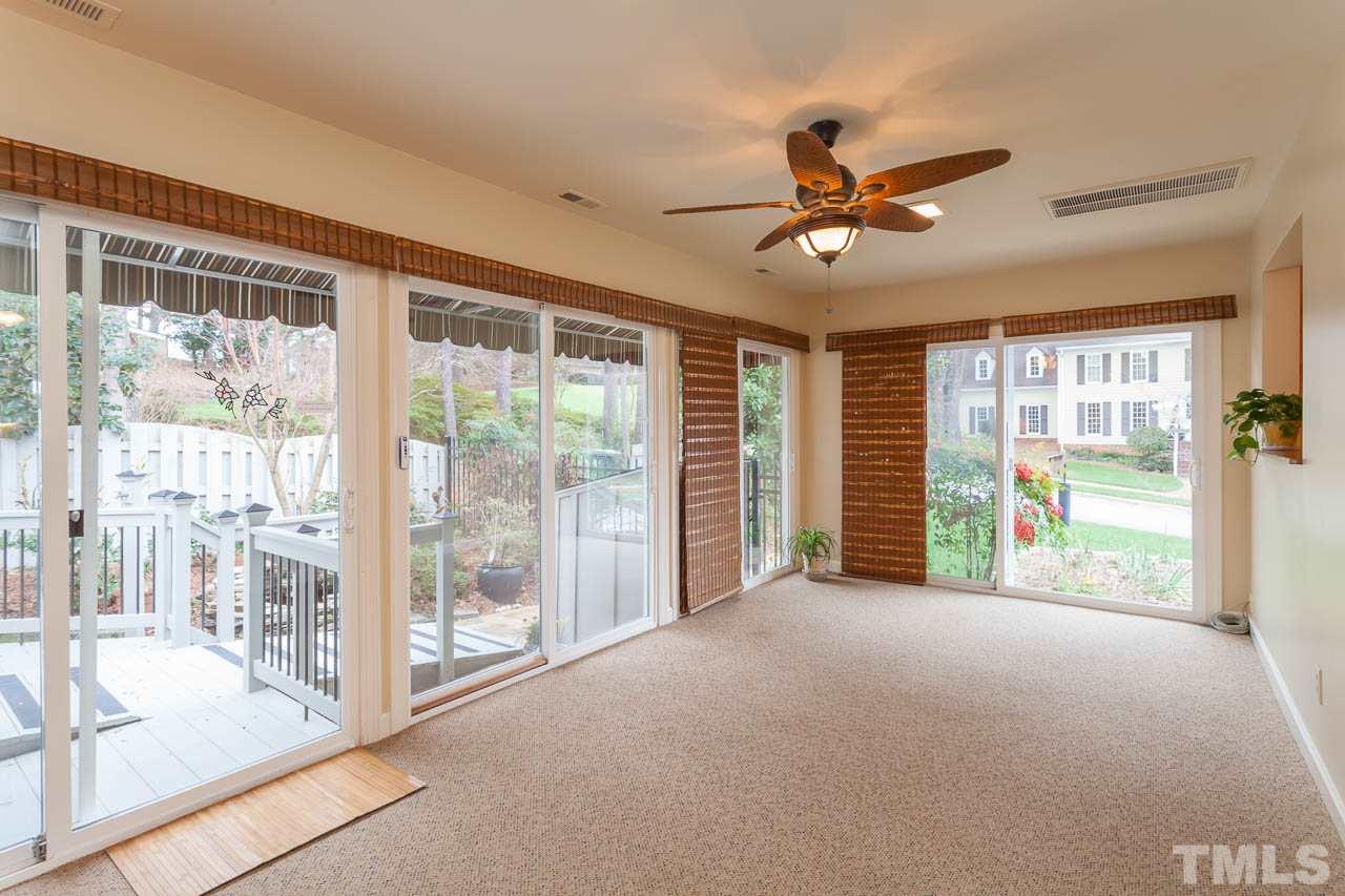 6909 Valley Ridge Court Raleigh, NC 27615 - Photo 14 of 25 a view of a livingroom with a ceiling fan and window