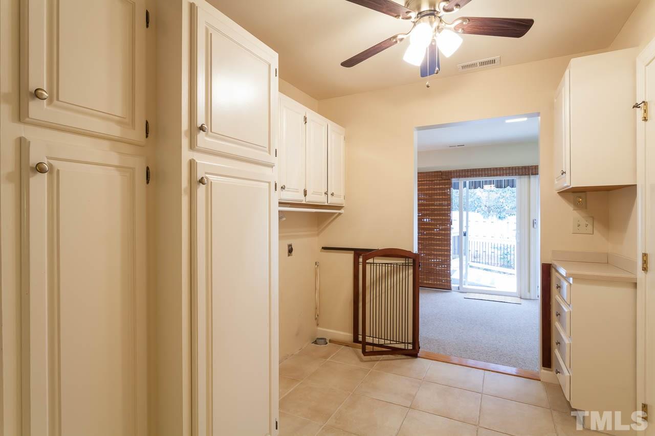 6909 Valley Ridge Court Raleigh, NC 27615 - Photo 16 of 25 a view of a hallway with a elevator