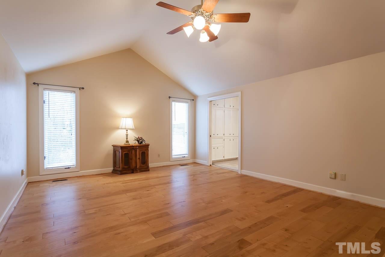 6909 Valley Ridge Court Raleigh, NC 27615 - Photo 17 of 25 a view of a livingroom with a ceiling fan and window