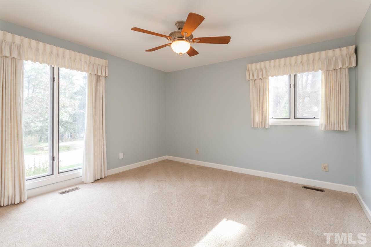 6909 Valley Ridge Court Raleigh, NC 27615 - Photo 22 of 25 a view of an empty room with a window