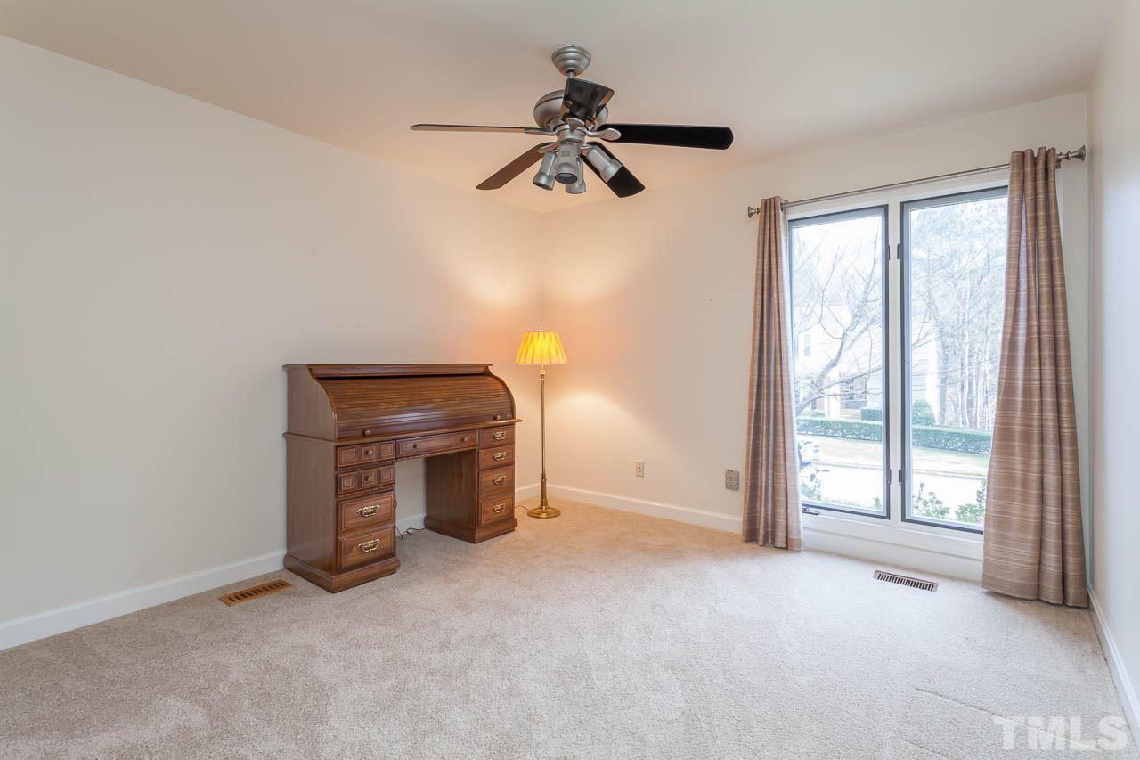 6909 Valley Ridge Court Raleigh, NC 27615 - Photo 23 of 25 a view of empty room with ceiling fan